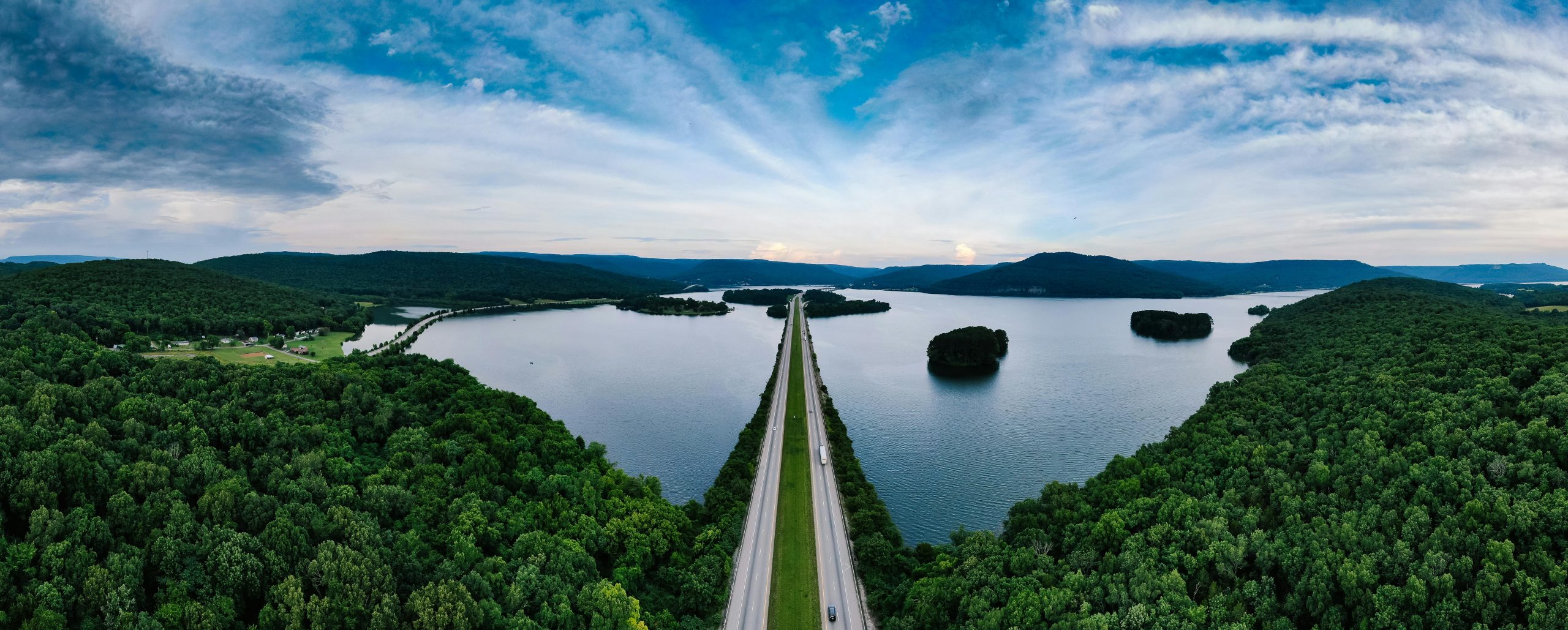 A breathtaking aerial view of Nickajack Lake and bridge in Tennessee, surrounded by lush greenery and serene waters.